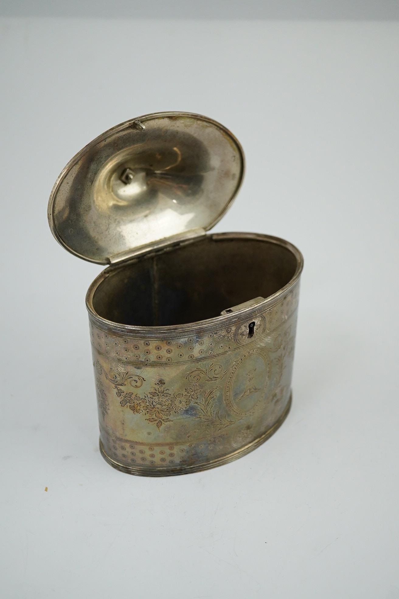 A George III silver oval tea caddy by Hester Bateman